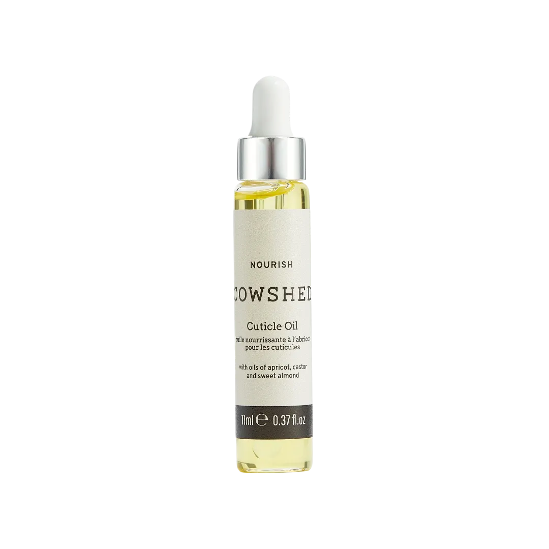 Bottle of Cowshed cuticle oil on a white background