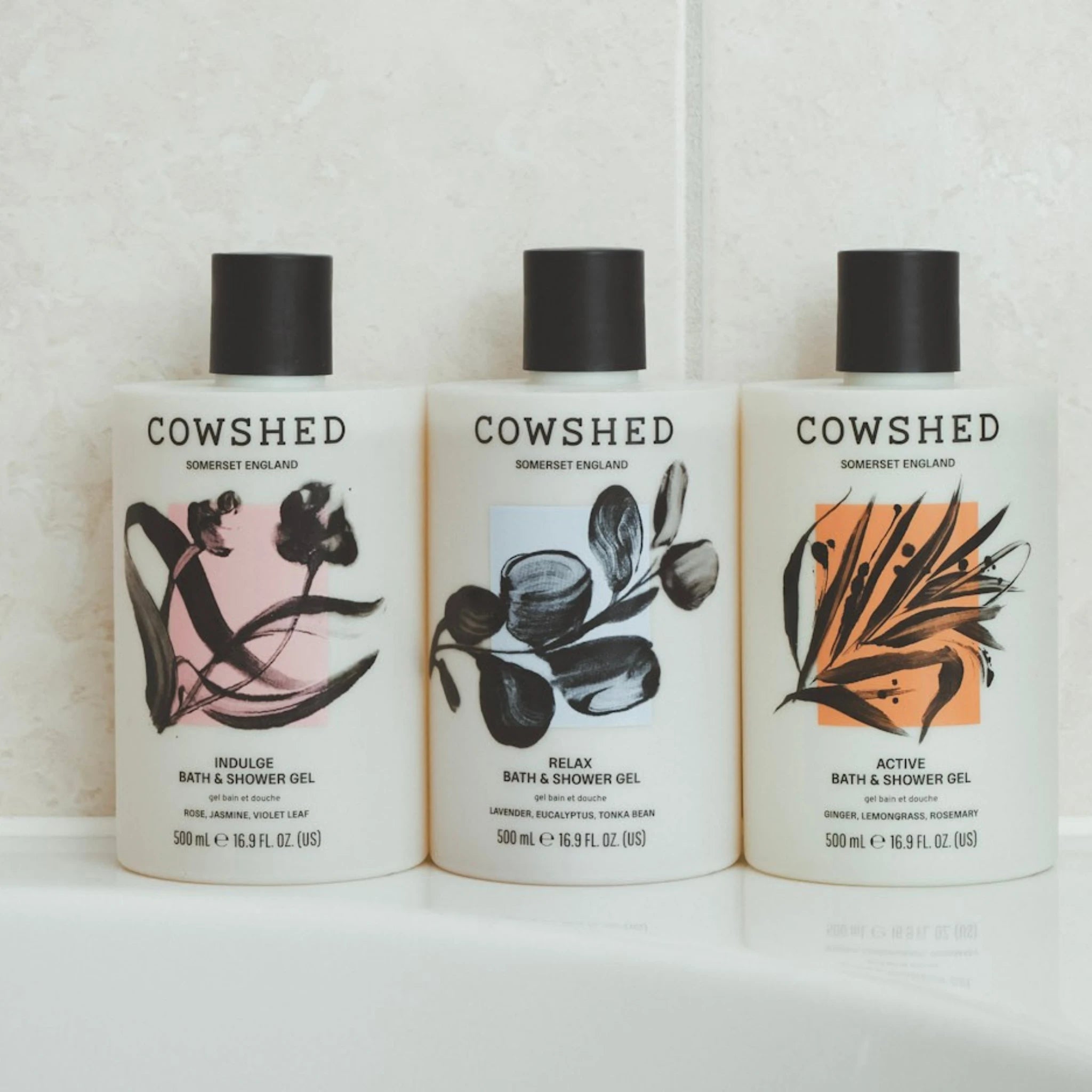 Three Cowshed bath and shower gel bottles on a white background