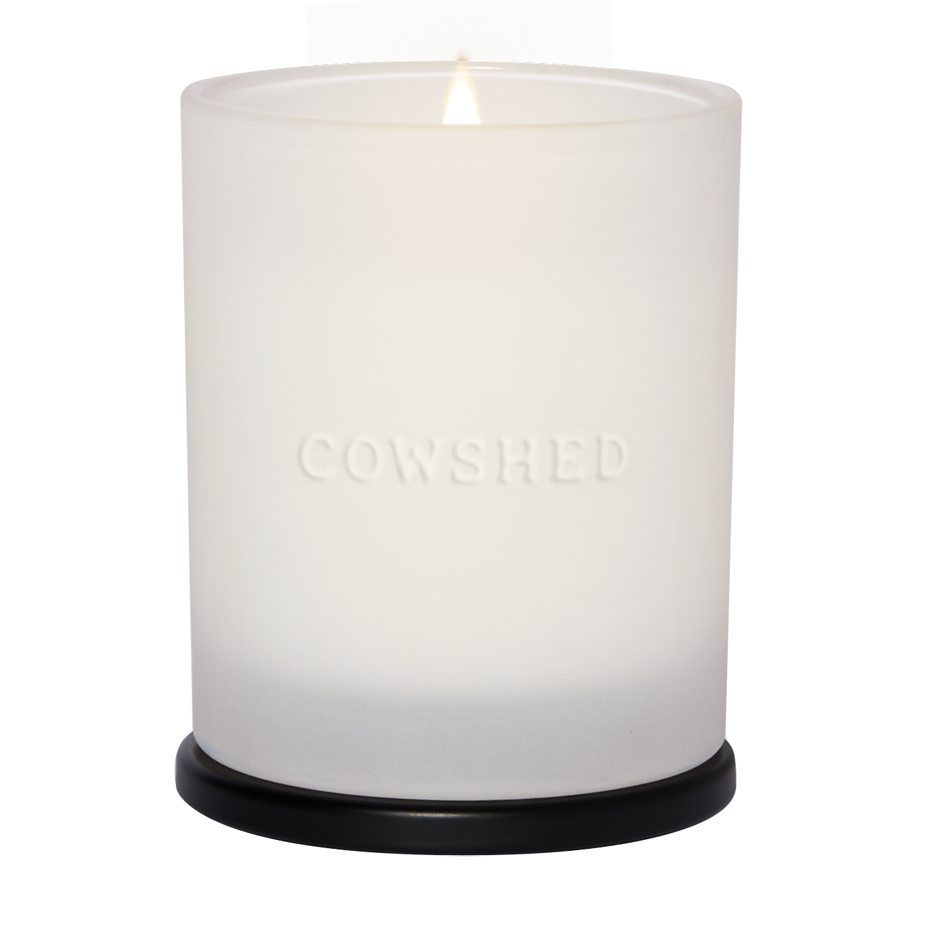 Cowshed Relax candle with flame burning