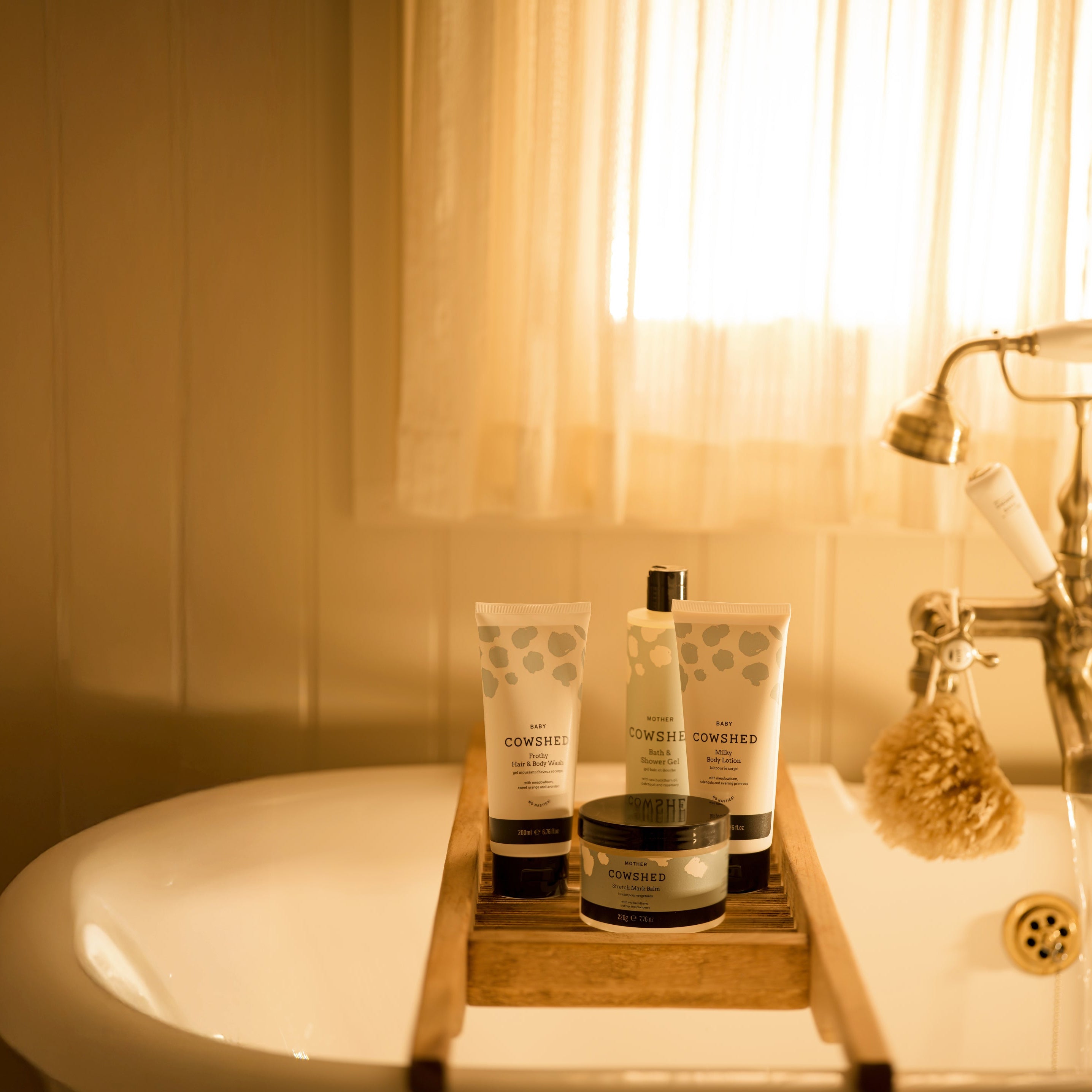 Bathroom setting with bath products on a tray by a bathtub
