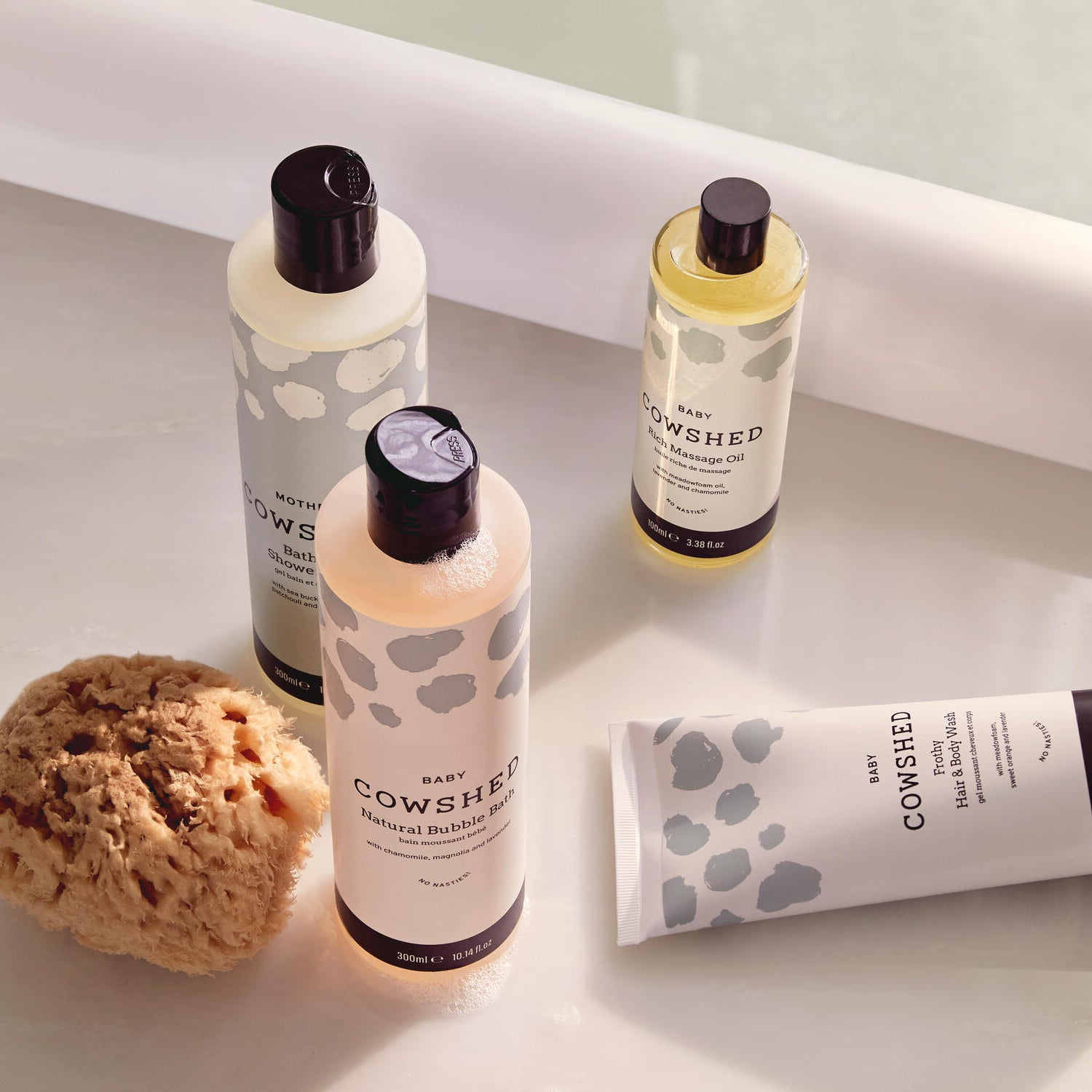 Cowshed baby skincare products on a light surface