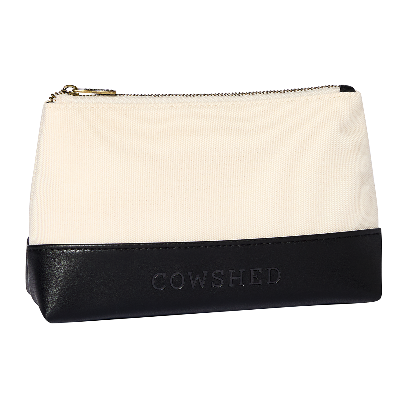 Cosmetic bag with black bottom half and white top half, featuring 'Cowshed' branding.