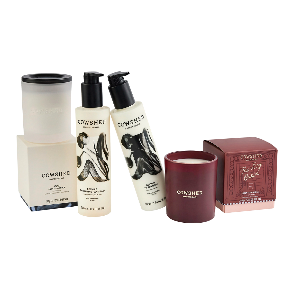 Cowshed The After Party Set featuring a white hand care set, a relax scented candle in a frosted jar, a dark red winter candle