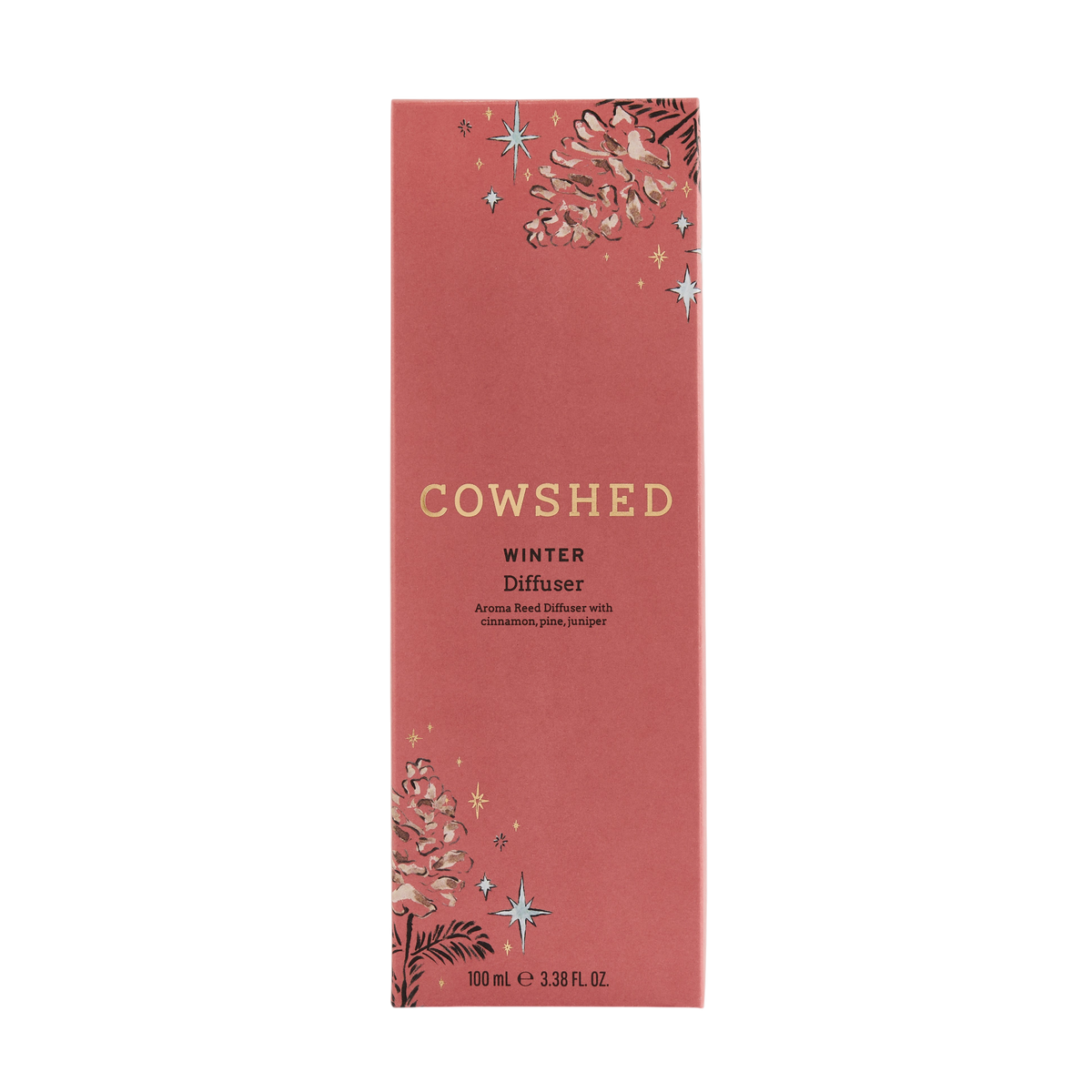 Cowshed Winter Diffuser box packaging in a dusty rose color with gold lettering and winter-themed illustrations of pinecones, pine needles, and stars.